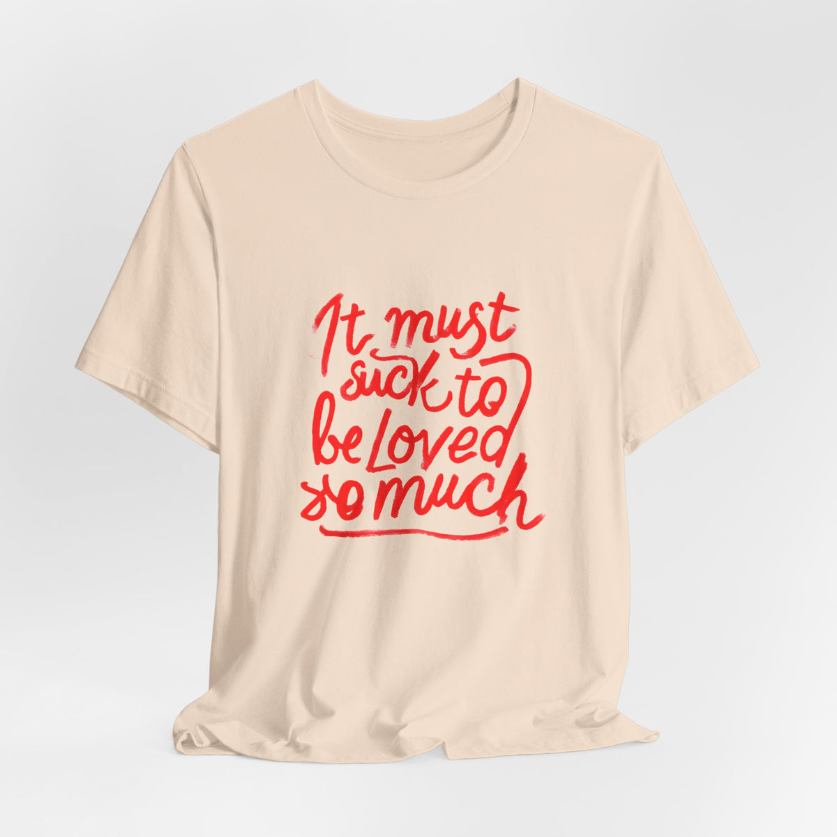 T‑Shirt — “It Must Suck to Be Loved So Much” Red Script Tee