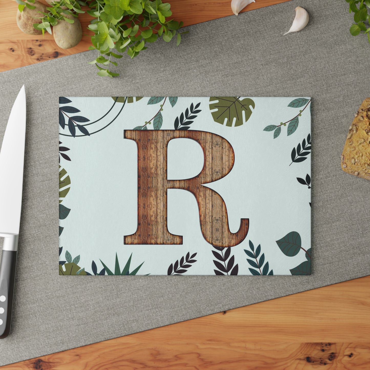 Monogram 'R' Glass Cutting Board — Rustic Wood Letter on Botanical Background