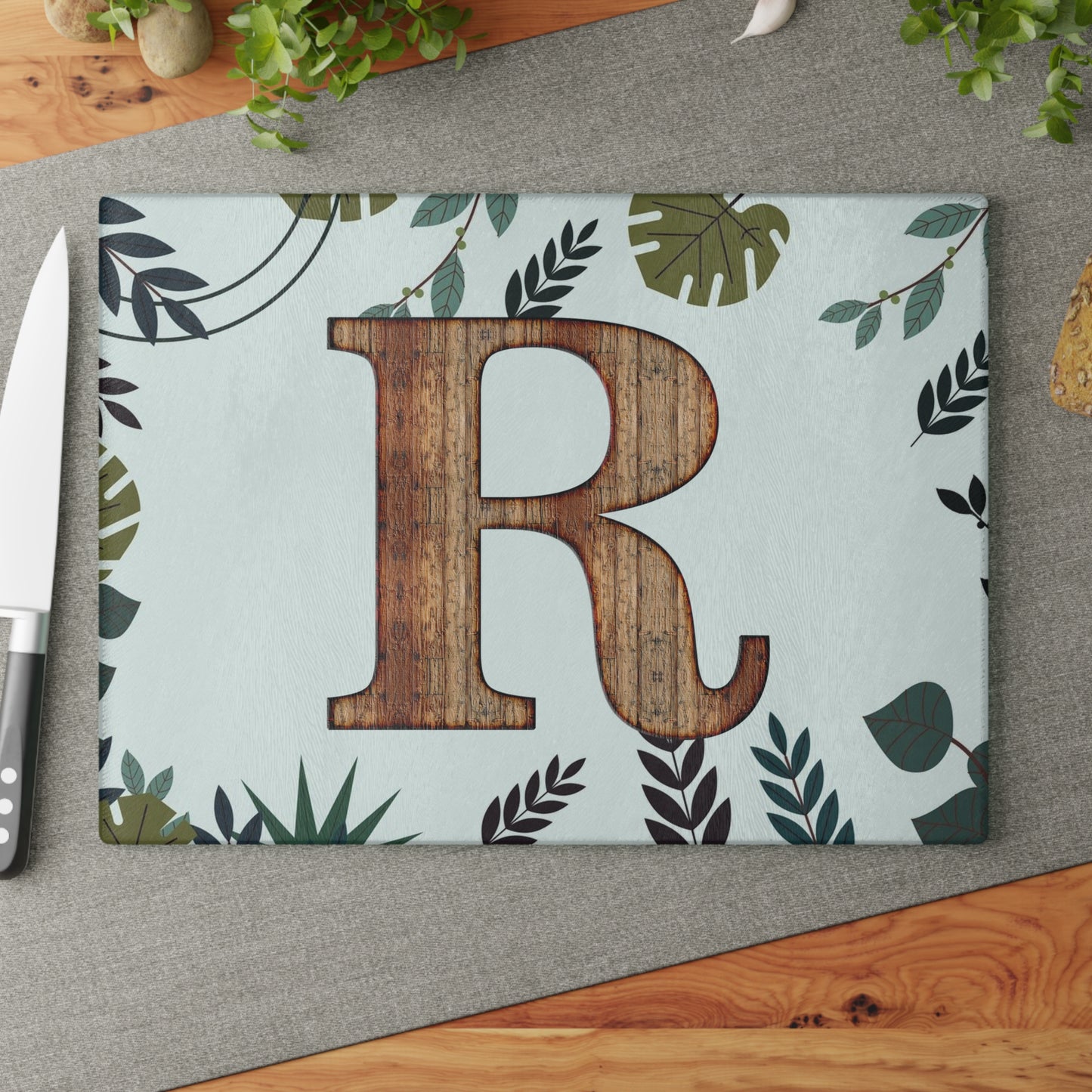 Monogram 'R' Glass Cutting Board — Rustic Wood Letter on Botanical Background