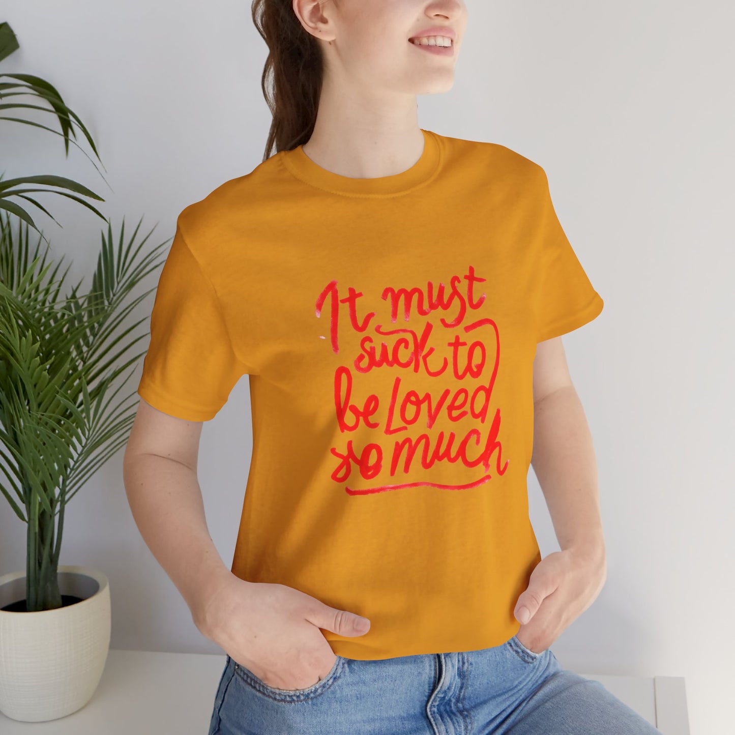 T‑Shirt — “It Must Suck to Be Loved So Much” Red Script Tee