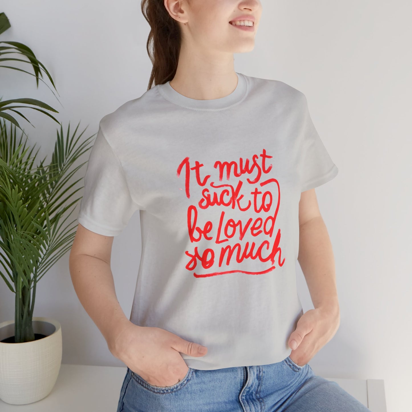 T‑Shirt — “It Must Suck to Be Loved So Much” Red Script Tee