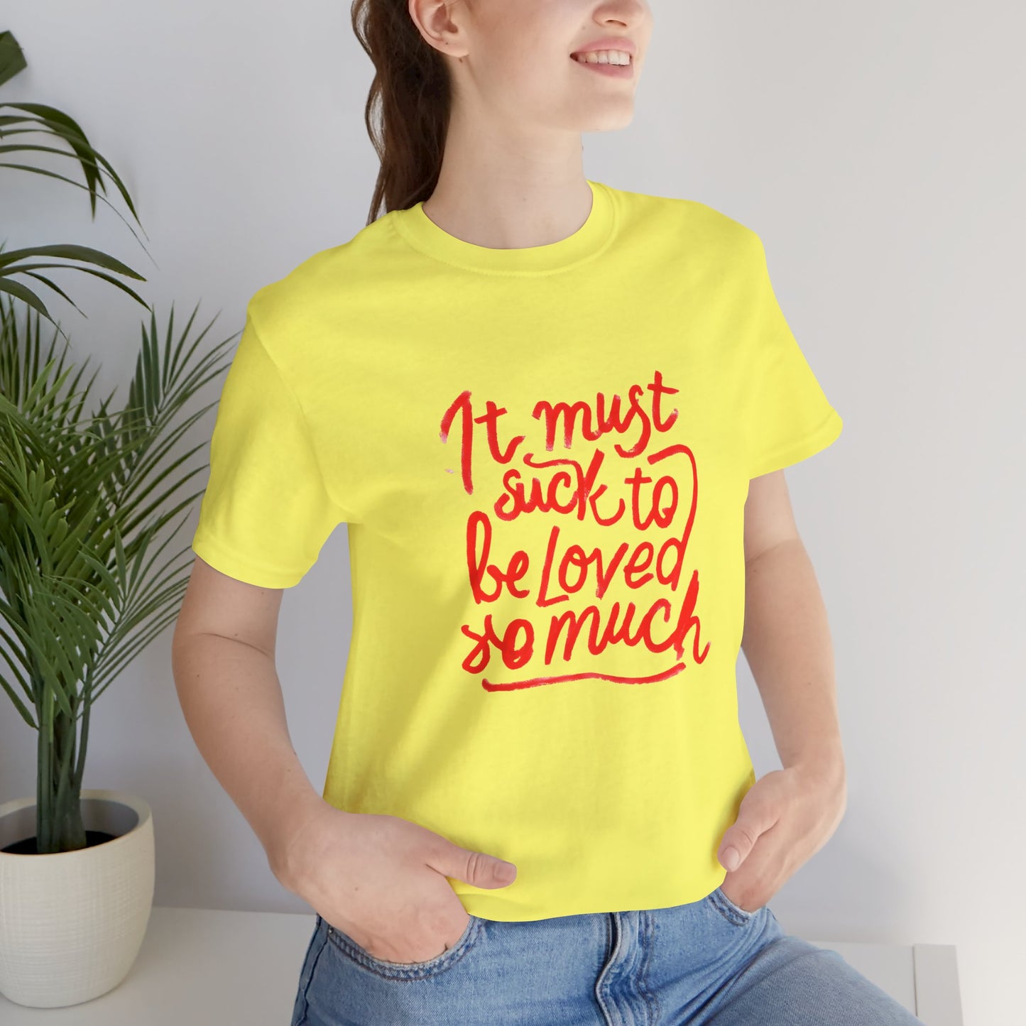 T‑Shirt — “It Must Suck to Be Loved So Much” Red Script Tee