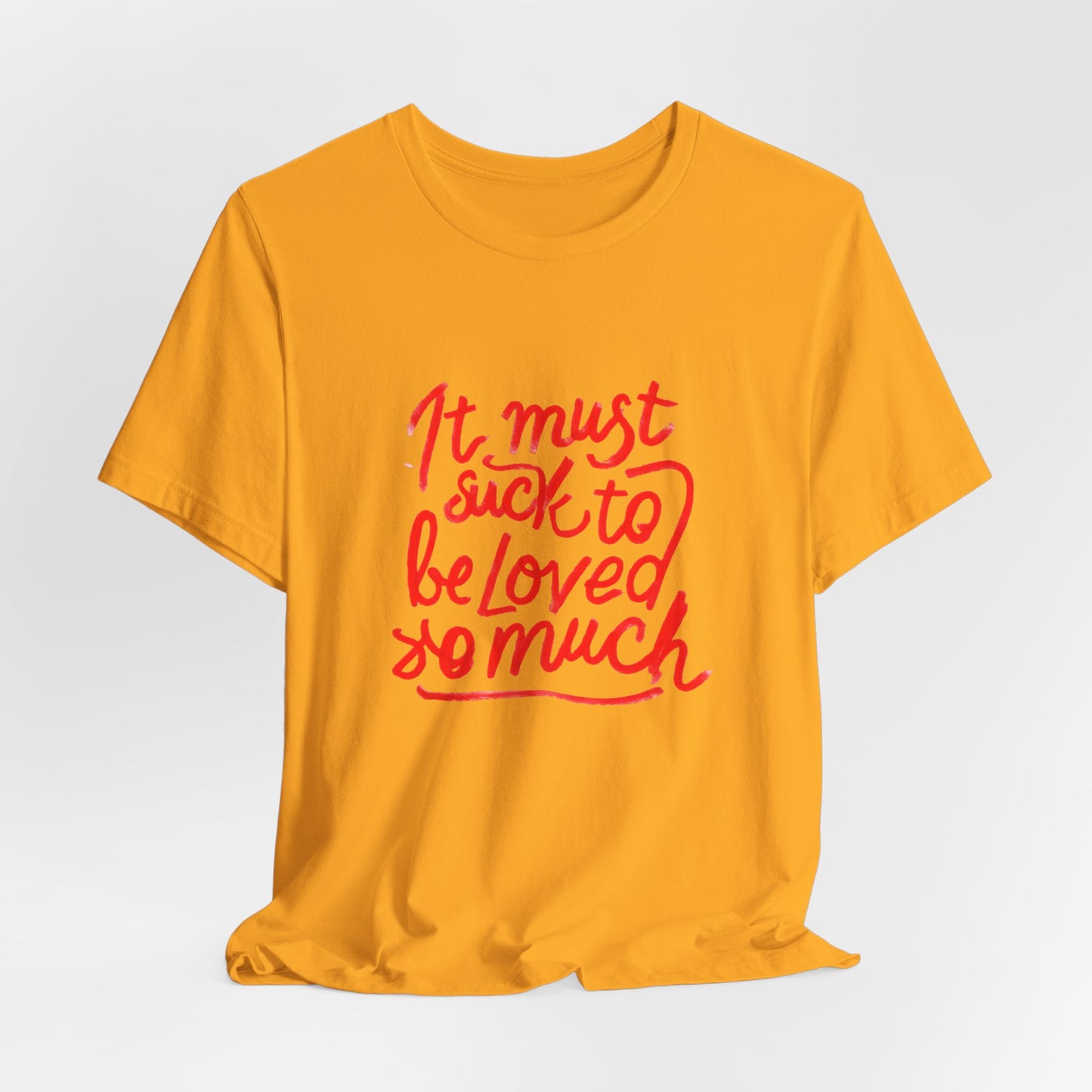 T‑Shirt — “It Must Suck to Be Loved So Much” Red Script Tee