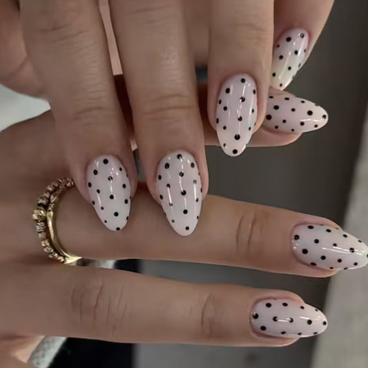 Black dots almond on white background press-on nails