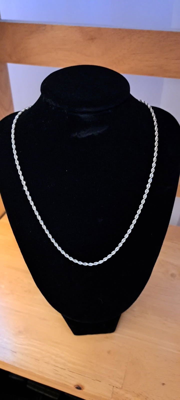 Sterling silver rope chain necklace is 16 inches long. It is made of 925 silver and has a twisted rope design.