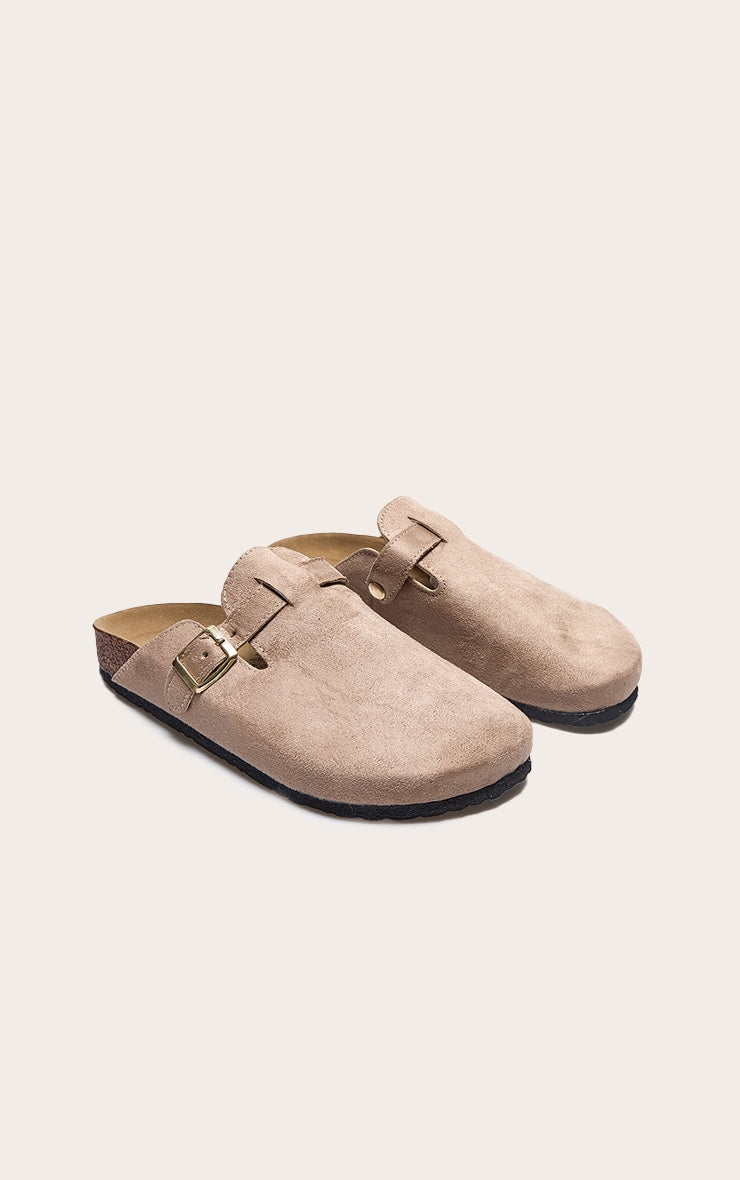 https://cdn-img.prettylittlething.com/c/1/8/3/c18395f6cd7bd609b0812eaca17bf9c258fbd83f_CNC5699_2_beige_faux_suede_buckled_mule_cloggs.jpg